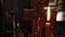 The flame of a candle on the background of the crucifixion of Jesus Christ. Video close-up.