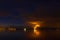 Flame on horizon of night cloudscape scene