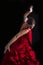 Flamenco dancer dressed in red with an expression