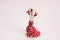 Flamenco dancer figurine on a pop pink background