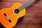 Flamenco guitar on wooden background