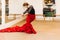 Flamenco woman dancer on a pose in the dance studio