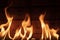 Flames against rustic wooden background