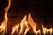 Flames against rustic wooden background