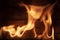 Flames against rustic wooden background