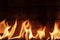 Flames against rustic wooden background