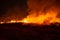 The flames burn in the dry fields and straw at night, the smog problem and global warming in Southeast Asia,