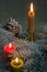 Flaming candles with Christmas twig