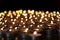 Flaming candles. Spiritual image of tealights providing sacred l