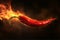 Flaming Chili Pepper on Dark Background