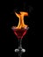 Flaming cocktail over black