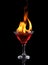 Flaming cocktail over black