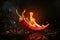 A flaming hot red chilli pepper on fire. Burning hot spicy chilli food