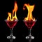 Flaming red cocktails over black