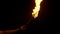 Flaming Torch Is Held Up In The Dark