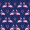 Flamingo in xmas hat with candy cane heart seamless pattern on blue polka dots background.