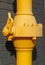 A flange connection and a control valve on a pipeline painted in yellow