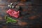 Flank, Bavette steak with seasonings, and fresh herbs raw meat, marbled beef . Dark wood rustic background. Top view space for