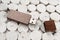 Flash drive in a brown brown wooden case on a structured gray background