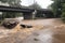 flash flood engulfs bridge, with cars and people swept away in raging waters