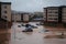 flash flood hits a town, with buildings and cars submerged in water
