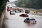 flash flood rescue on a busy highway with cars stranded in the rising water