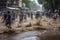 flash flood rushes through a busy street, with people rushing to escape the rising water