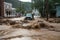 flash flood rushes through town, taking with it debris and vehicles