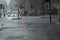 Flash flooding scene in central London with soaked people waiting at traffic lights and heavy rain