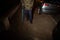 Flash illuminated Silhouette of senior man walking on French street at night