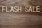 Flash Sale alphabet letters on wooden background business concept