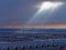 Flash of sunlight through cloud gap at airport