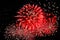 Flashes of red fireworks and scattering of white sparks