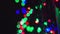 Flashing blurry shiny Christmas decorations outside at night in Northern countries, panning close up video