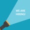 flashlight beam with we are hiring text