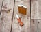 Flask and knife on wooden surface