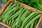 Flat beans on the wooden background