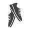 Flat black running shoes icon