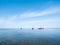 Flat bottom sailboats drying out at low tide on Waddensea near H