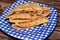 A flat bread with mashed fava beans mixed with oil, sesame tahini, cumin, spices, slices of chili pepper and onion, selective