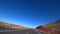 Flat California road. Desert landscape outside the car window. Bright sunny day. Death Valley California.