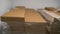 Flat cardboard boxes in stock. A pile of shipping boxes