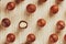 Flat composition with Australian macadamia nuts on bamboo light background. Patterns, repetitions