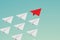 Flat design Leadership teamwork and courage concept. red paper plane and many white ones on sky