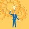 Flat design vector with a businessman inventing an idea with cogwheels in the background.