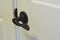 A flat door knob lever on the new door