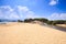 Flat Golden Sand Beach of Sea Bay under Low Tide