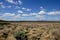 Flat grassland landscape with white clouds, Great Ocean Road, Australia