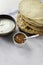 Flat Indian breads with raita and mango chutney served on the table