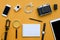 Flat lay of accessories on orange desk background